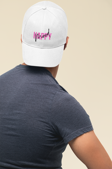 A Taylor Plus One cap and streetwear look photographed against a clean studio backdrop